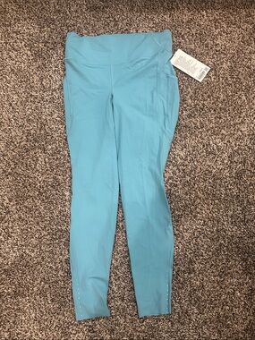 Fast and Free High-Rise Tight 28"
5 Pocket Washed Blue NWT Sz 12